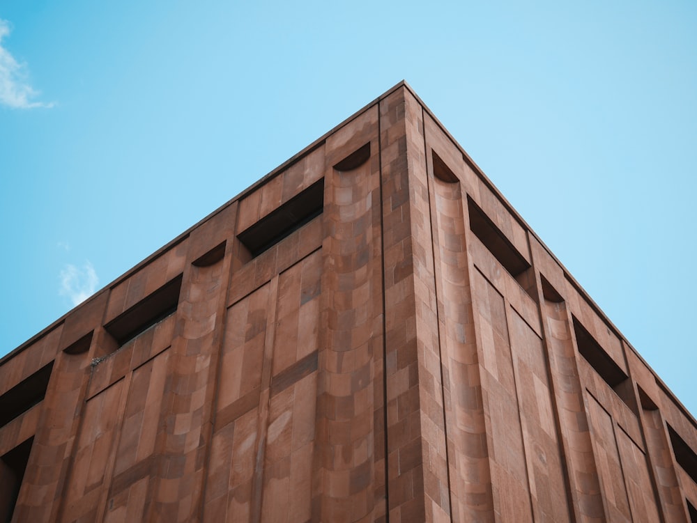 low angle photography of brown concrete wall