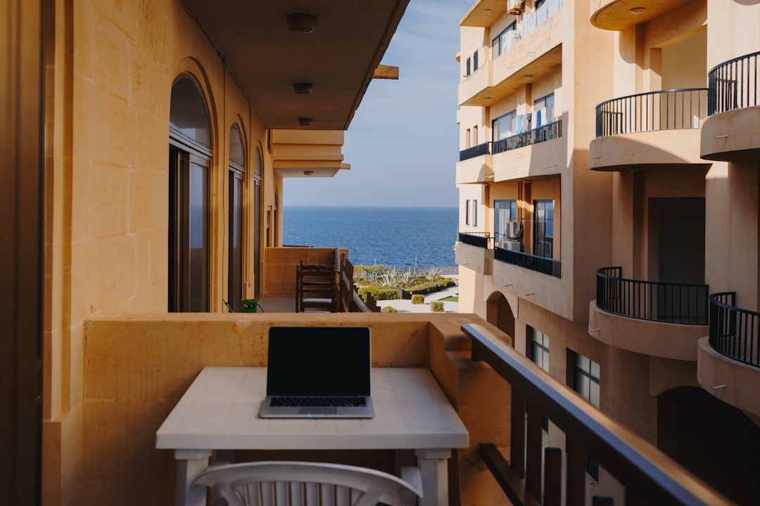 macbook pro on white table, Work with a view