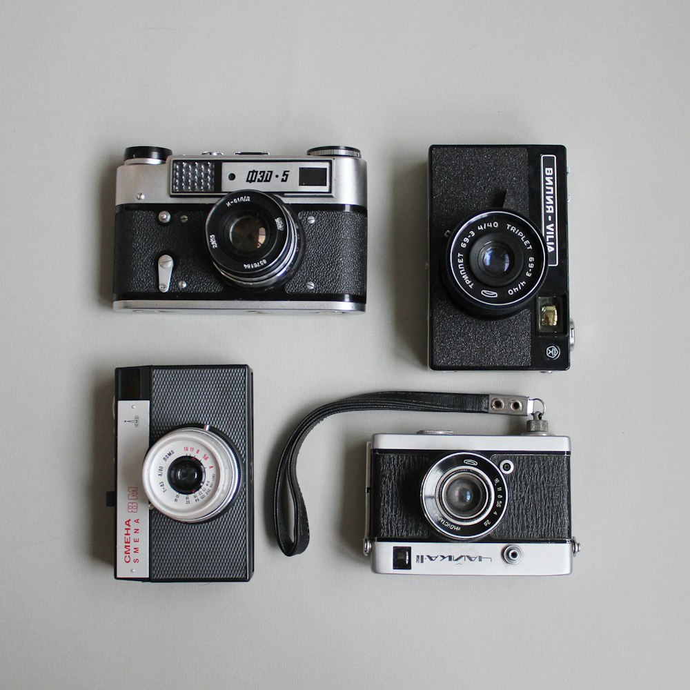 four assorted cameras