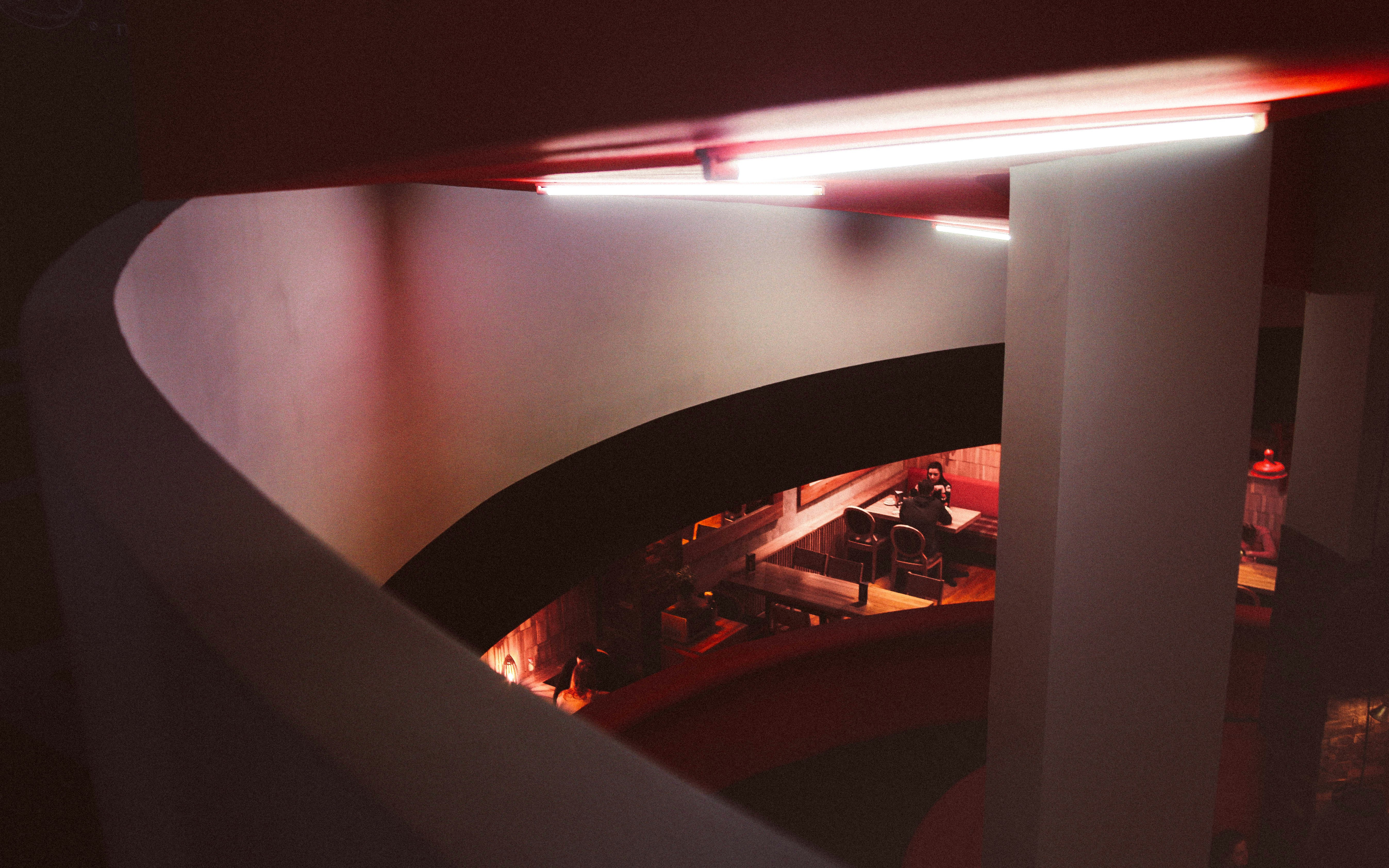 a view of a building from the top of a spiral staircase
