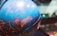 A blue celestial globe depicting various constellations, including detailed illustrations and labels such as Leo, Ursa Major, and Leo Minor. The globe features intricate lines connecting stars within the constellations against a vibrant blue background.
