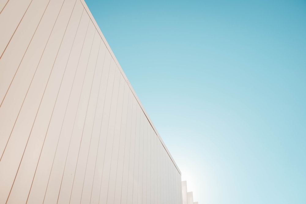 low-angle photography of building under clear blue sky