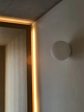 A sleek, minimalistic room showcasing flawless drywall and elegant finishes in soft lighting.