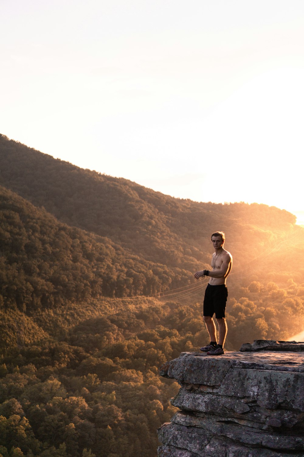 man standing on cliff