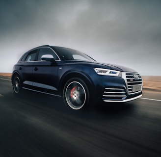 black Audi Q7 SUV on road