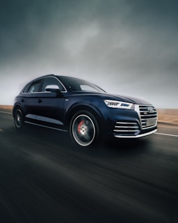 black Audi Q7 SUV on road