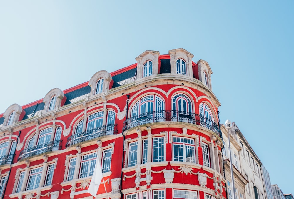 low angle photo of red and white painted structure