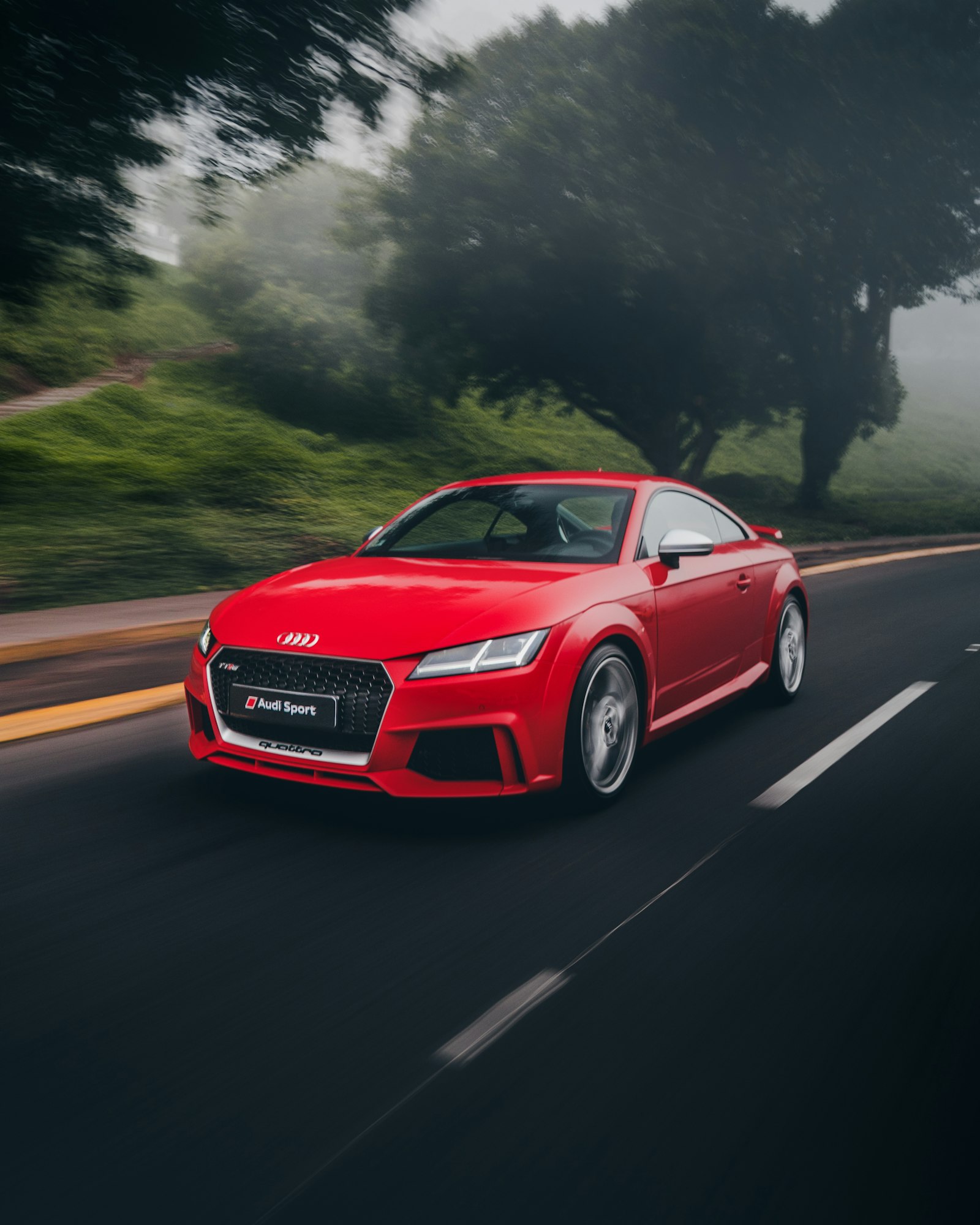 Sony a6500 + Sony E 10-18mm F4 OSS sample photo. Red audi coupe on photography