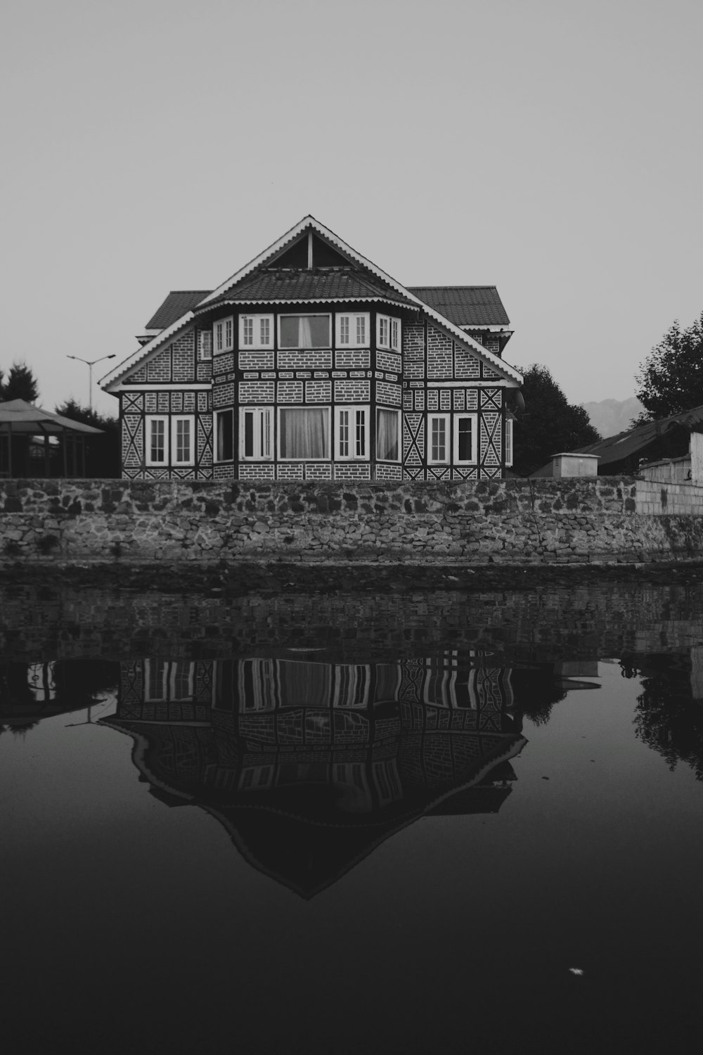 gray house near body of water