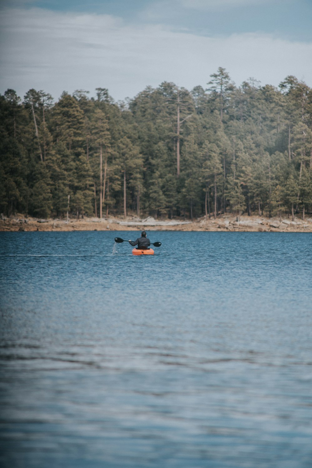 person rowing kayak