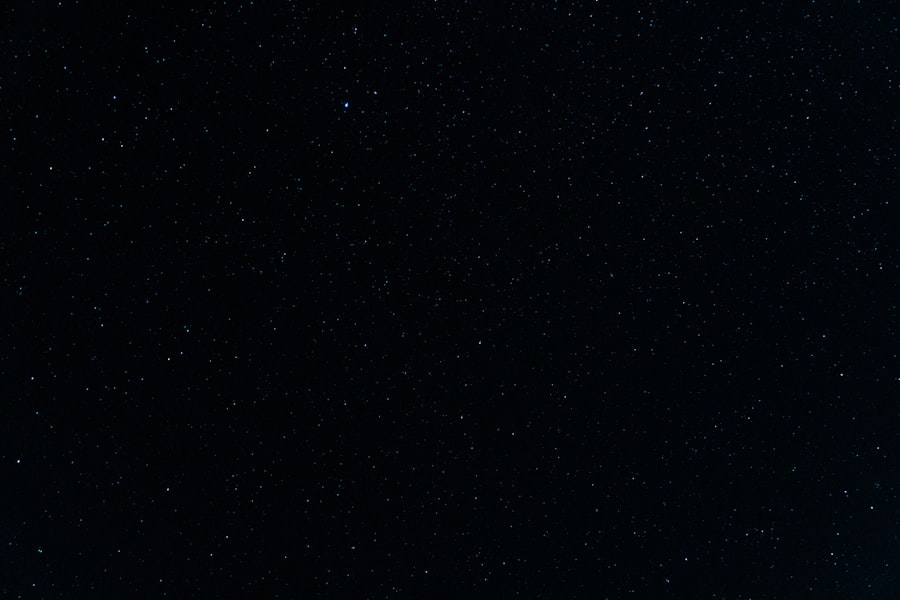 Dark sky with thousands of stars above bushland silhouette