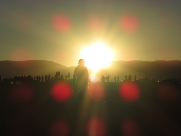 A stunning sunset over a nature reserve with models posing.
