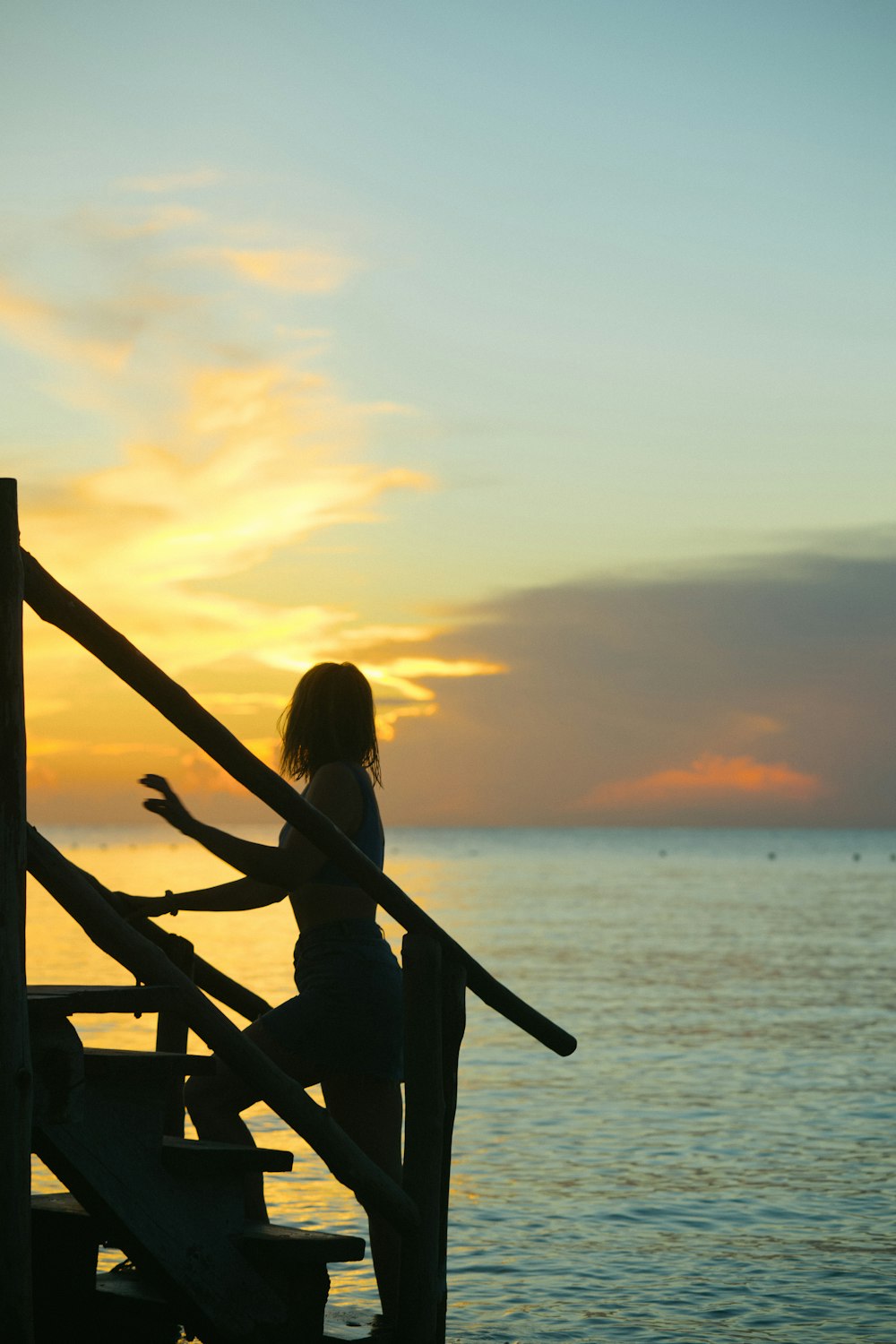 silhouette of woman on stairs