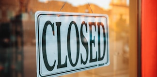 selective focus photography of Closed signage