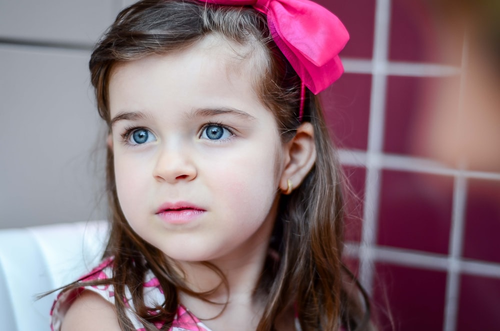 girl wearing pink headband