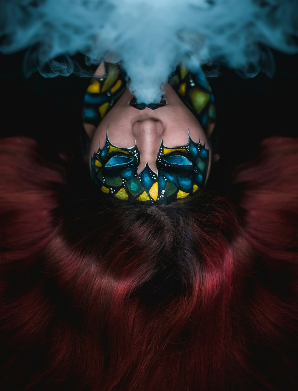 woman blowing smoke