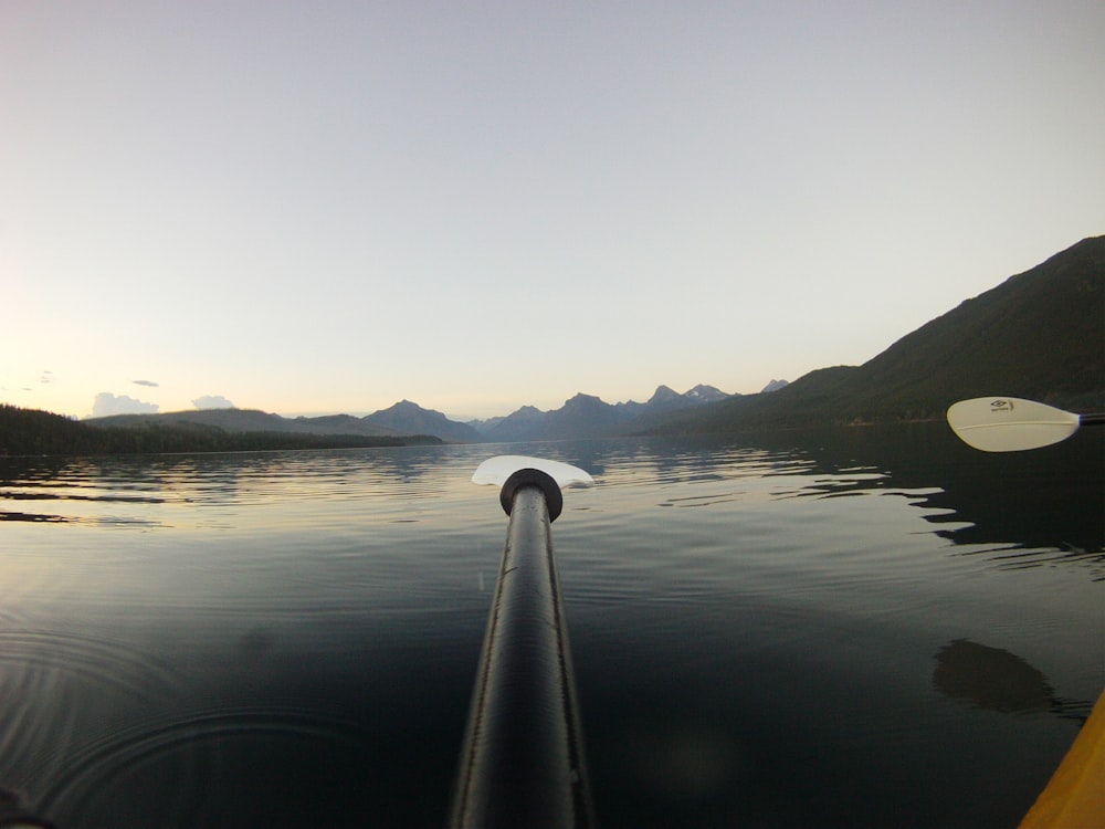 a view of a body of water with mountains in the background