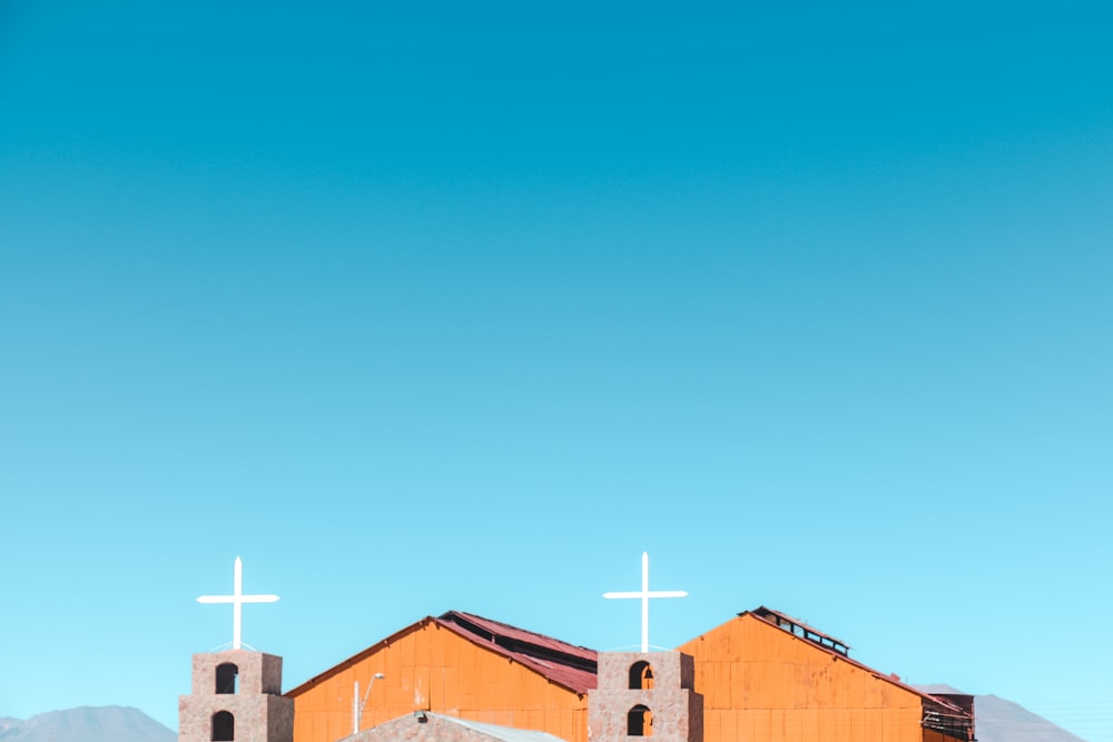 brown wooden church under blue sky during daytime
