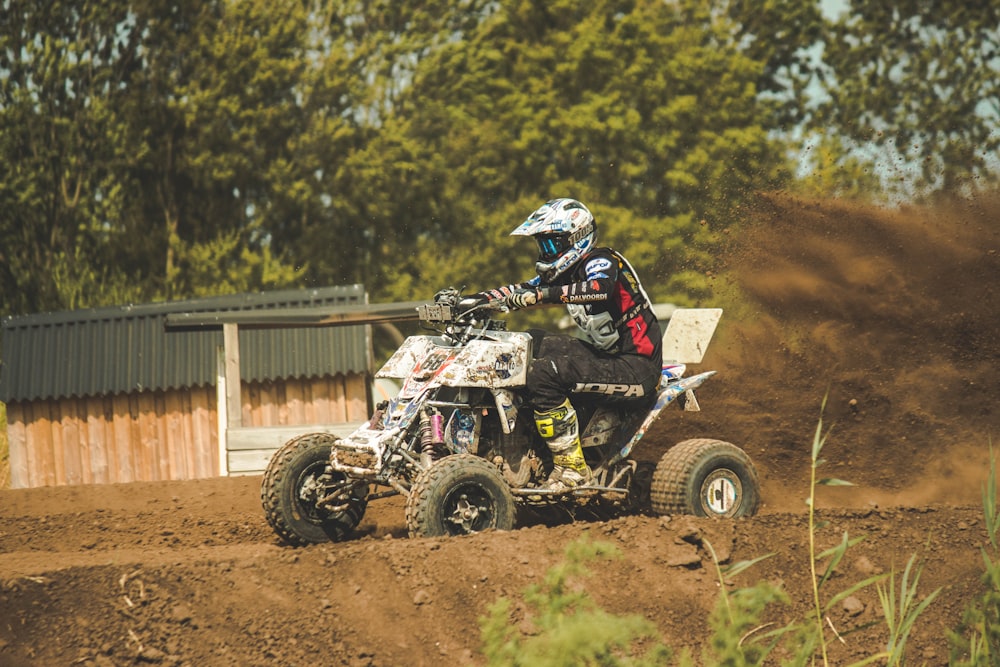 ATV rider on dirt track at daytime