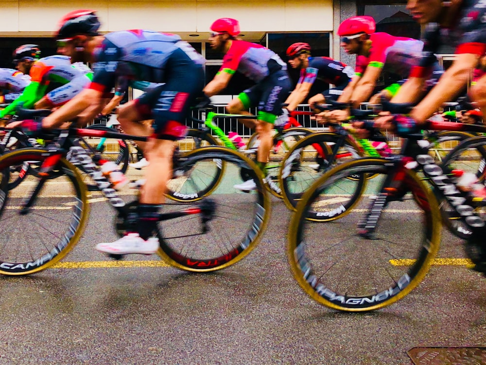 people riding bikes on road during daytime