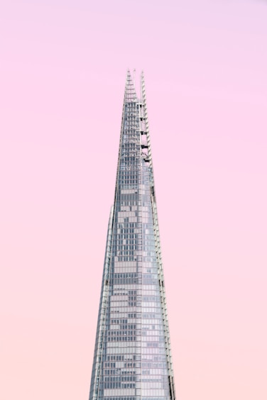 gray concrete tower under cloudy sky
