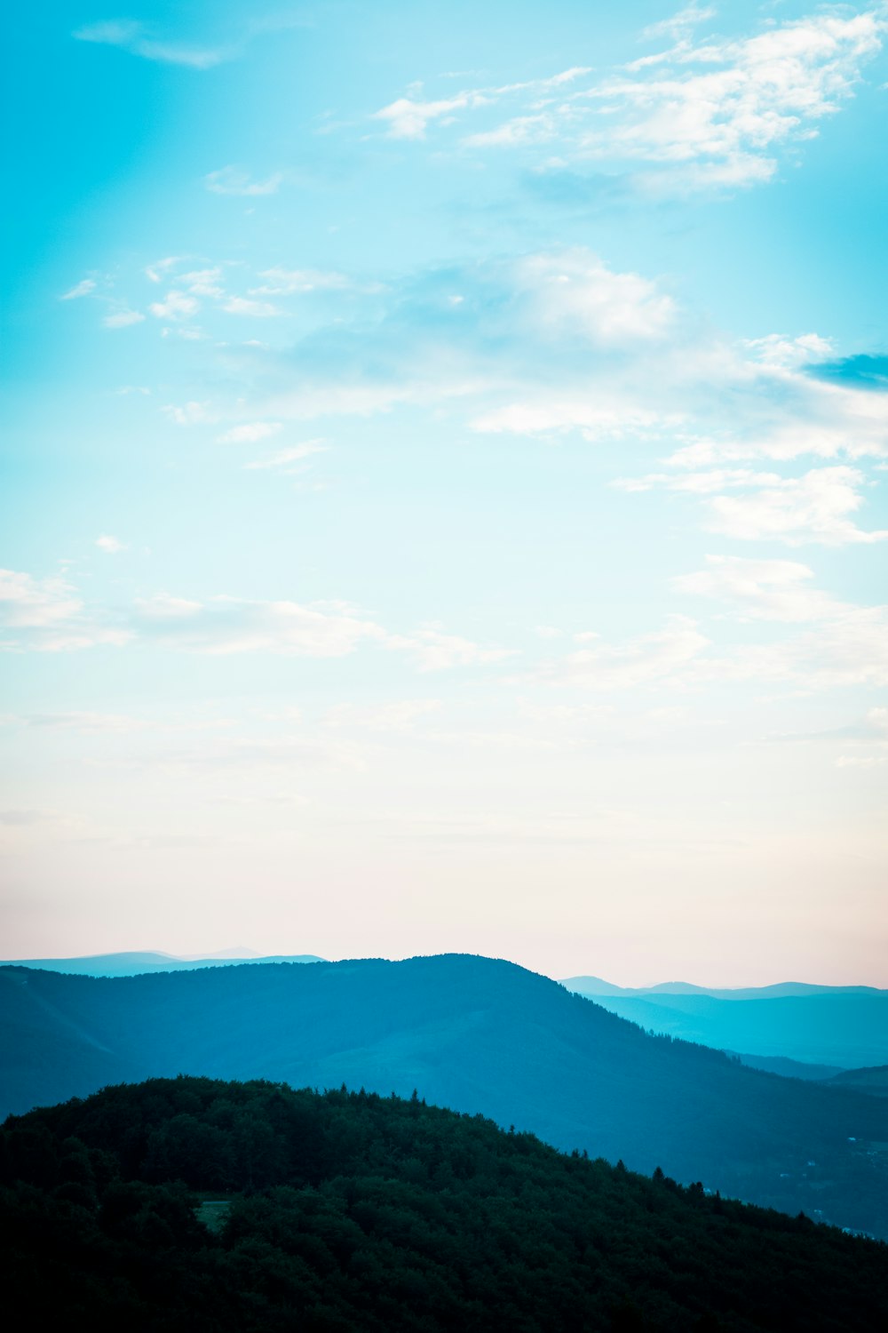 green mountain under white cloud