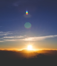 silhouette of mountain during sunset