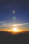 silhouette of mountain during sunset