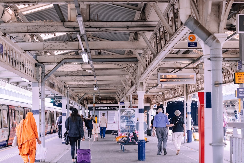 people walking on train station