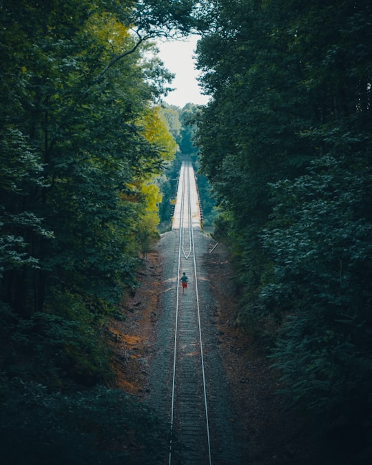 person walking in the middle of railway in Rock Island United States