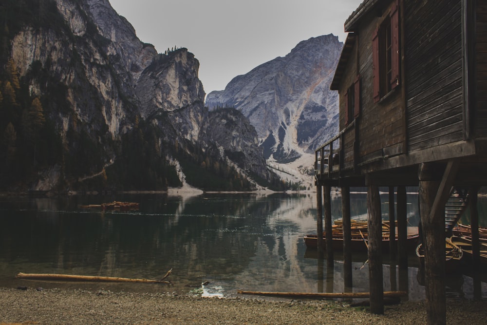 cabin beside large body of water during day time