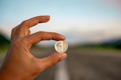 hand with the coin to pay for translation services
