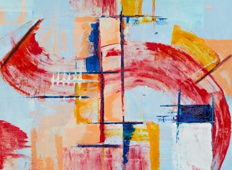 Abstract painting featuring bold geometric shapes and dynamic brushstrokes. Prominent use of red, blue, and yellow tones, creating a sense of movement and contrast. The composition includes intersecting lines and arcs that form a sense of depth and dimension.