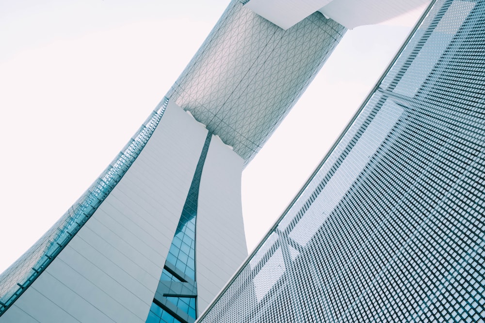 person showing white concrete building