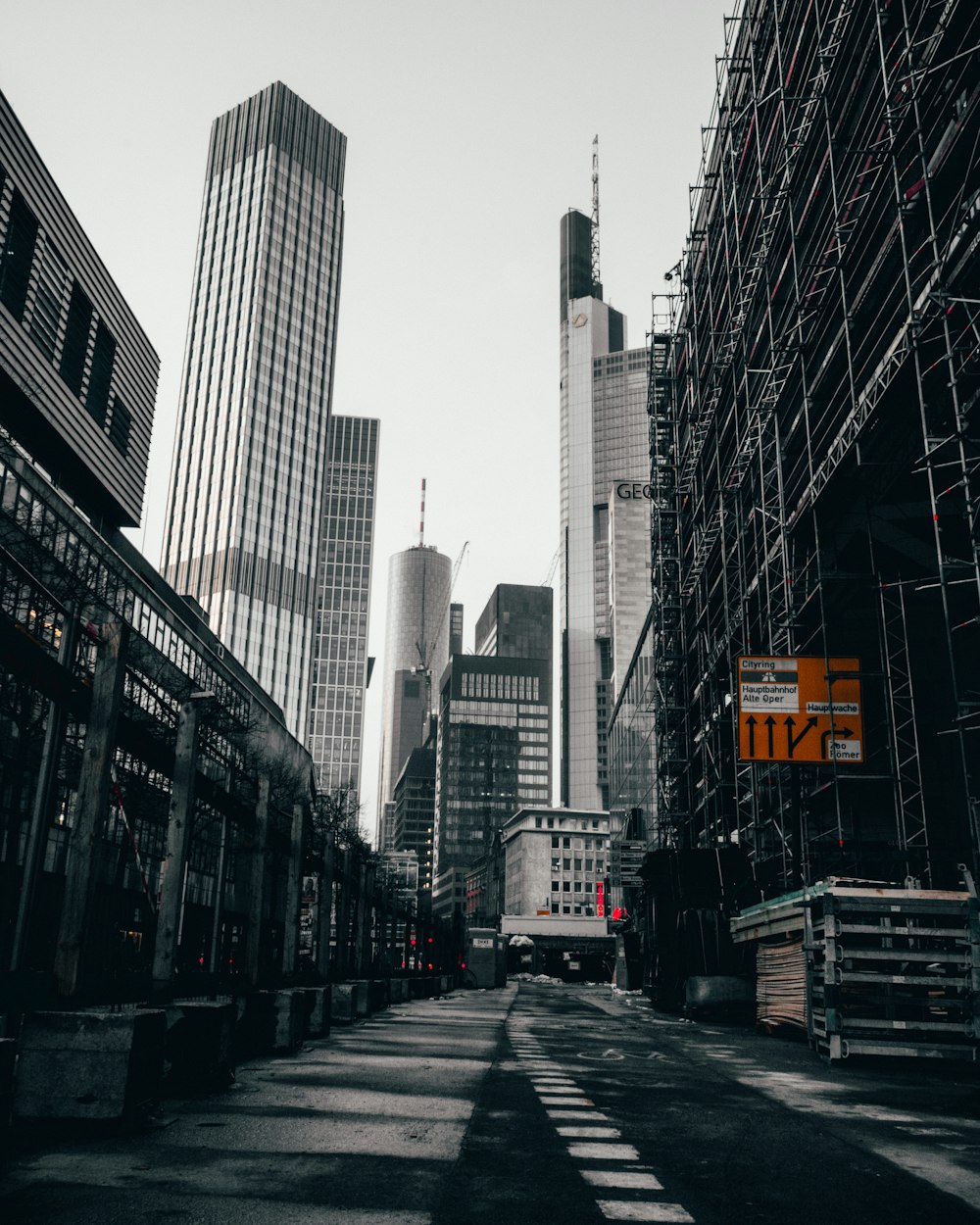 gray road between skyscrapers