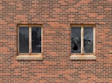 two broken glass building windows