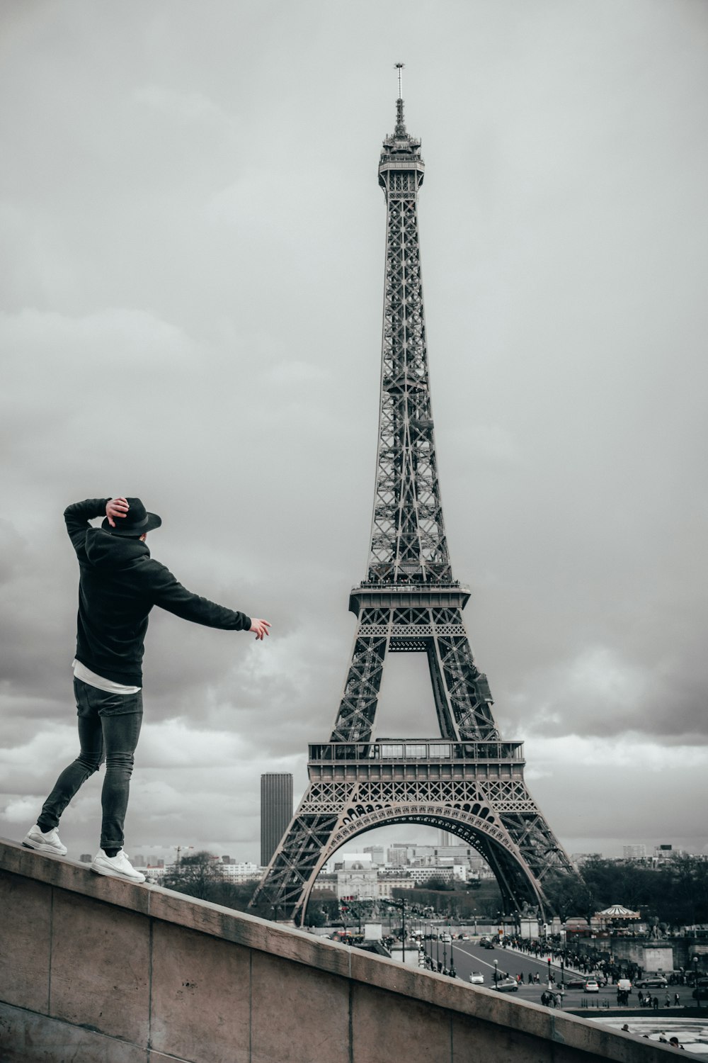 man beside Eiffel Tower