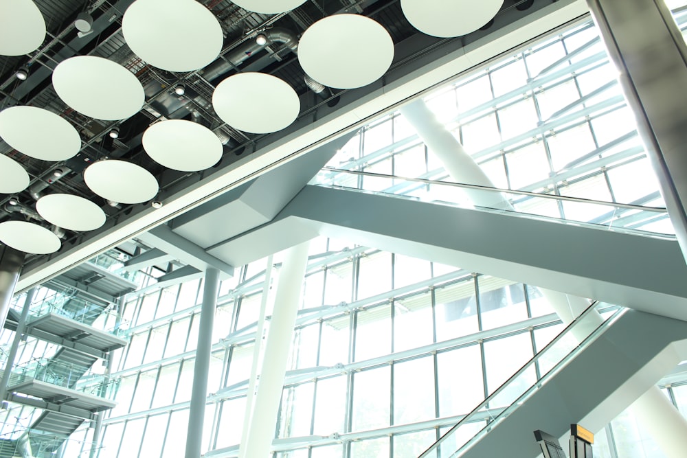 the ceiling of a large building with lots of windows