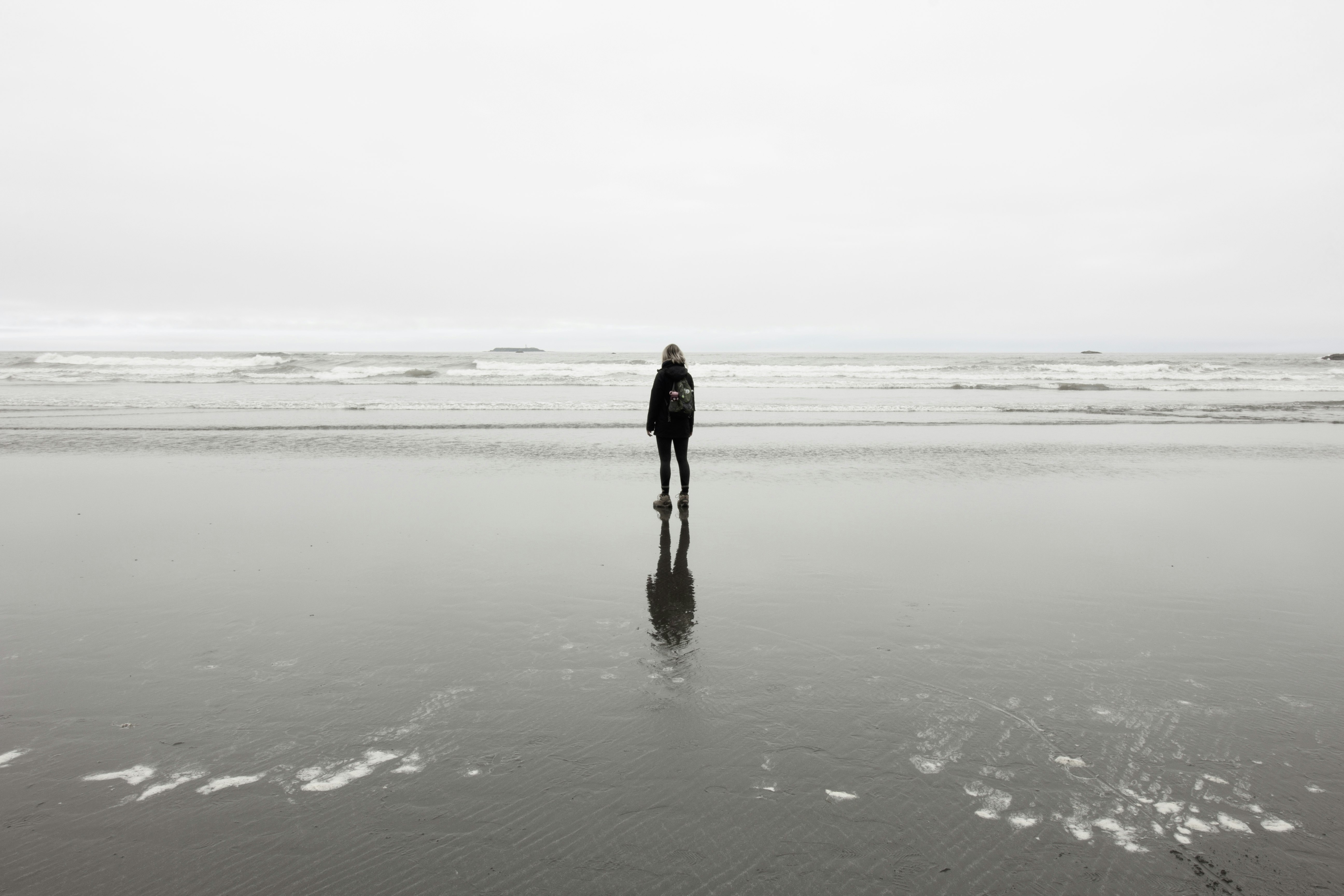 person standing near sea at daytime