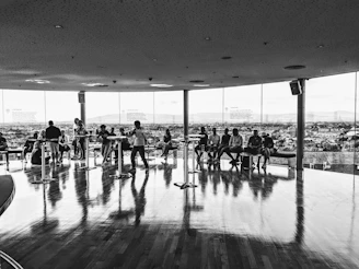 Sophisticated meeting room with panoramic city views, bathed in natural light.