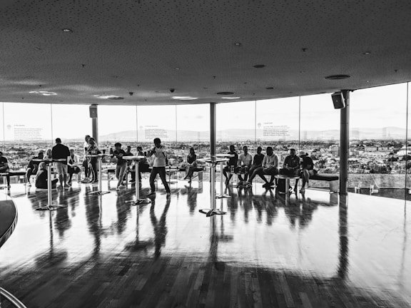 Sophisticated meeting room with panoramic windows overlooking a city skyline.