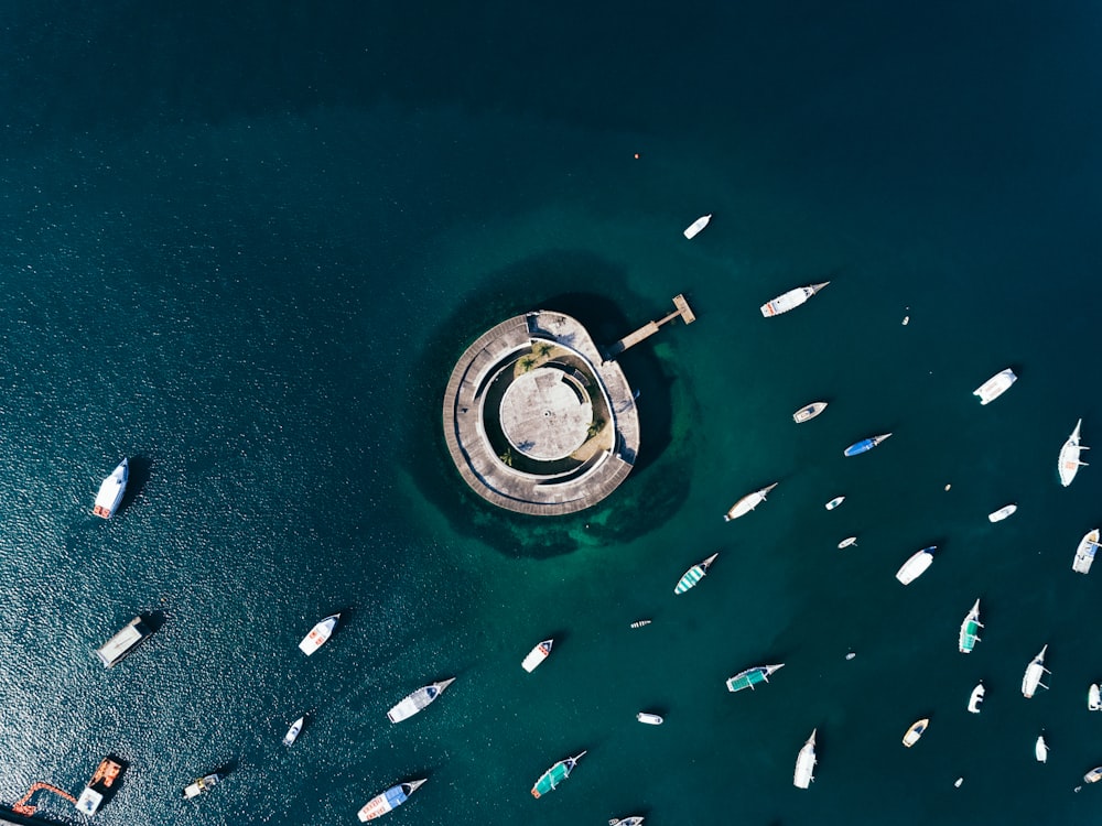 aerial photography of boats and building on body of water during day