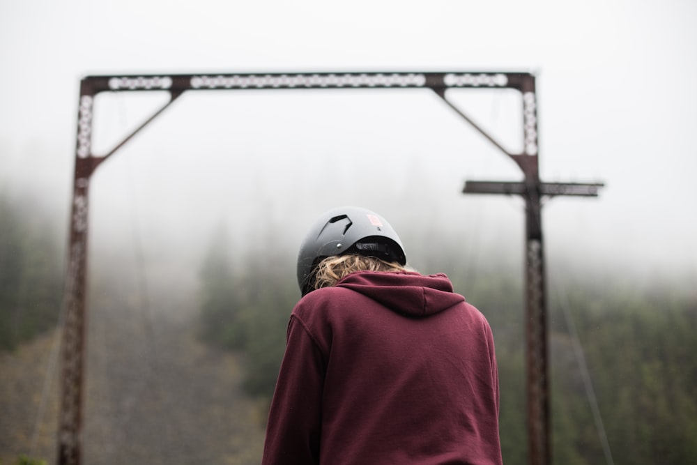 person wearing maroon hoodie