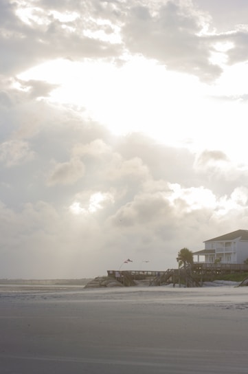 A cozy coastal home with a welcoming front porch overlooking Newport Beach.