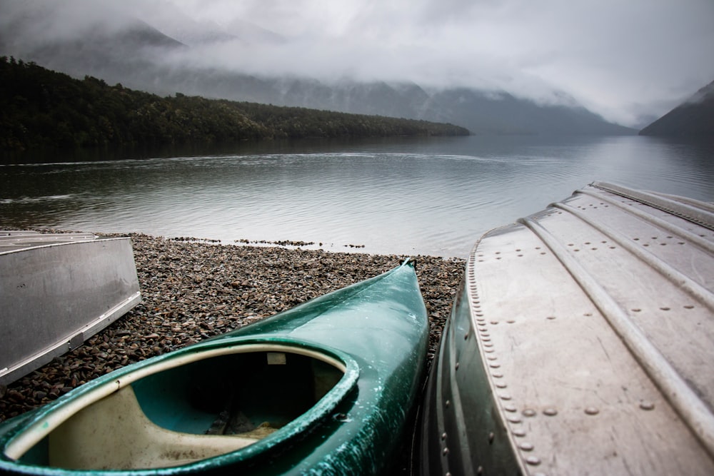 green kayak near body of water