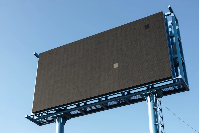 Large-format outdoor billboard against the sky