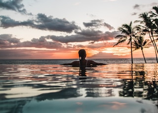 woman swimming on infinity pool