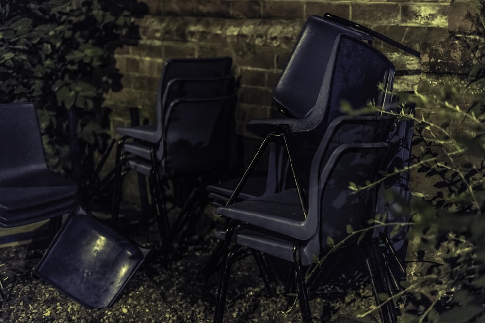 blue chairs beside wall