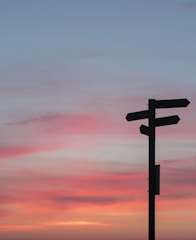 silhouette of road signage during golden hour