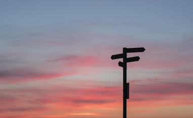 silhouette of road signage during golden hour